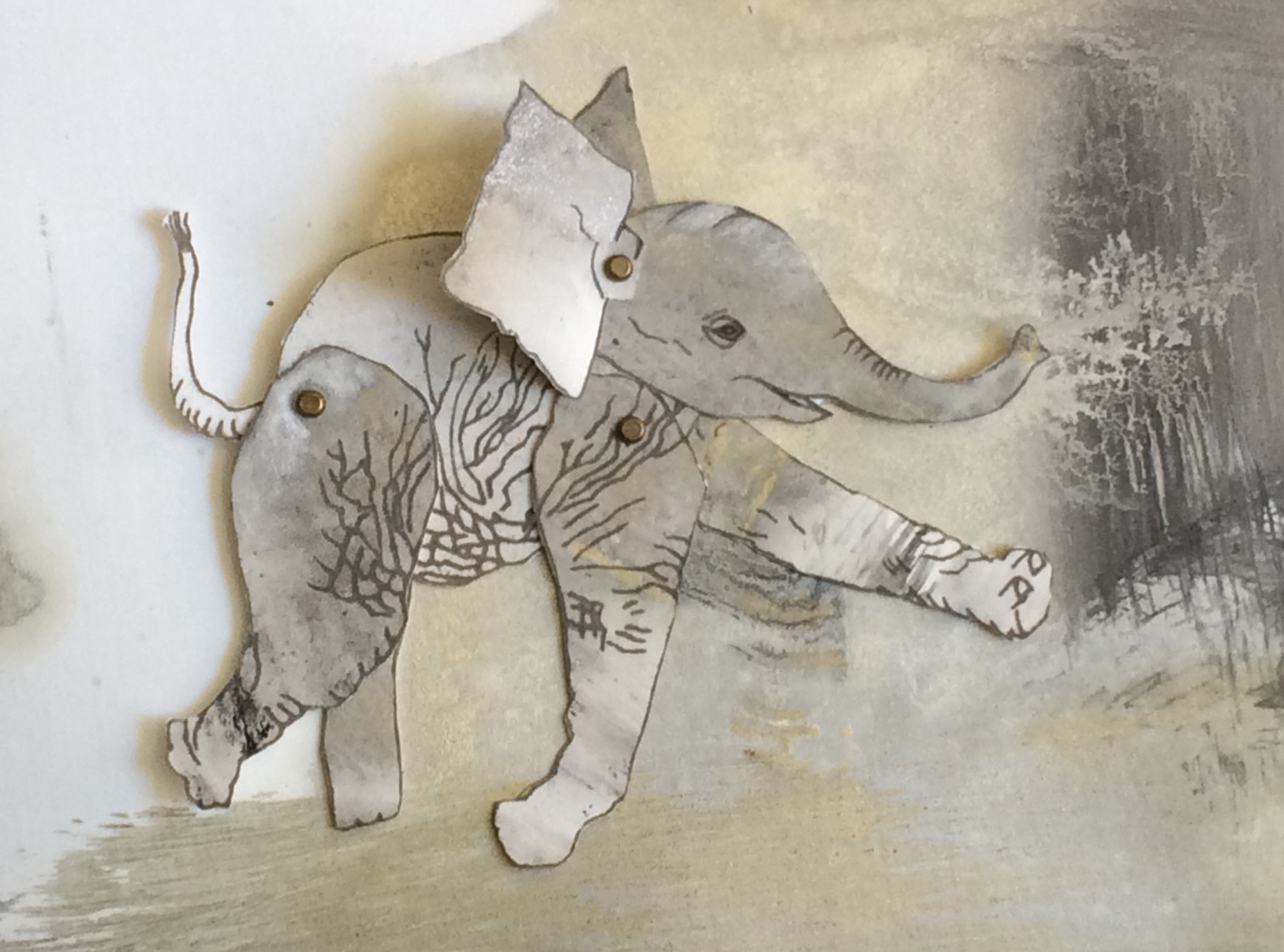 painting of baby elephant with limbs joined by paper fasteners