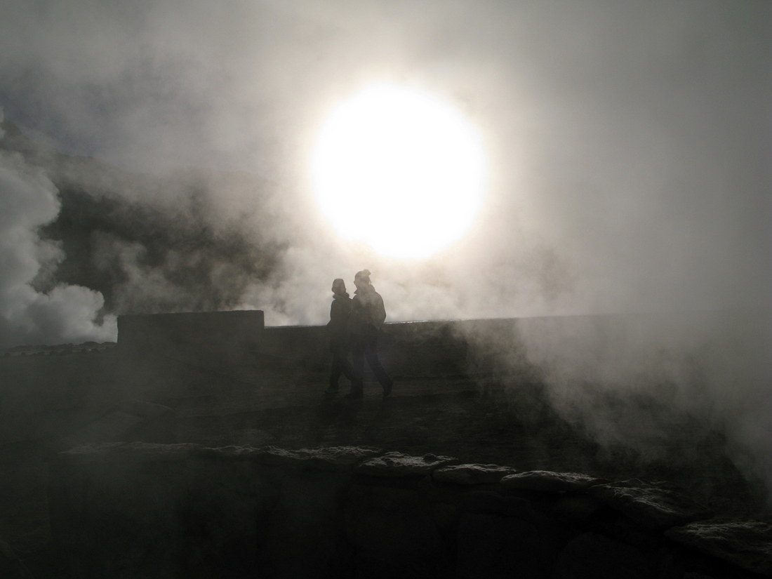 eery view of figures with steam rising around them