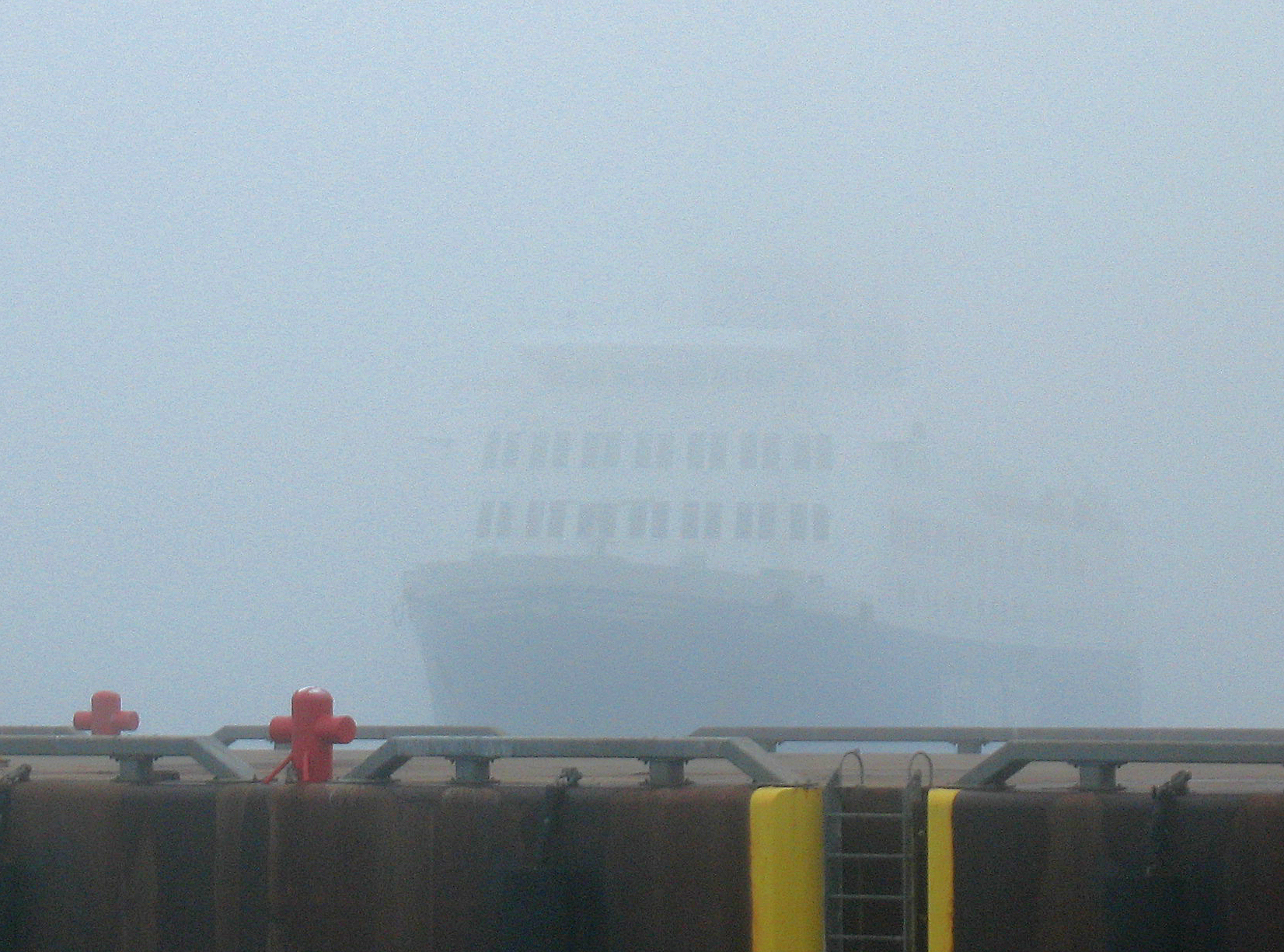 photo of a ship in the mist